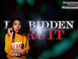 logo forbidden fruit e donna sconvolta con pop corn in mano