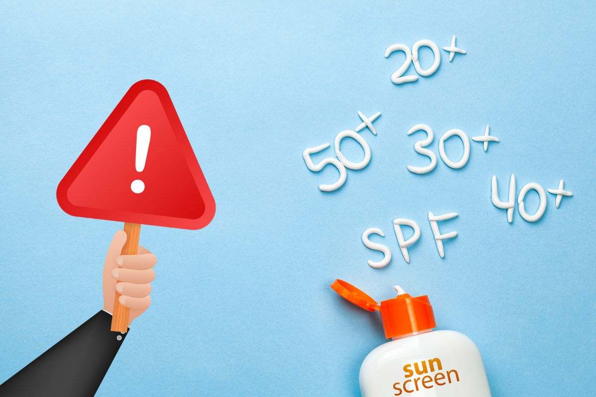 crema solare fattori di protezione e simbolo attenzione